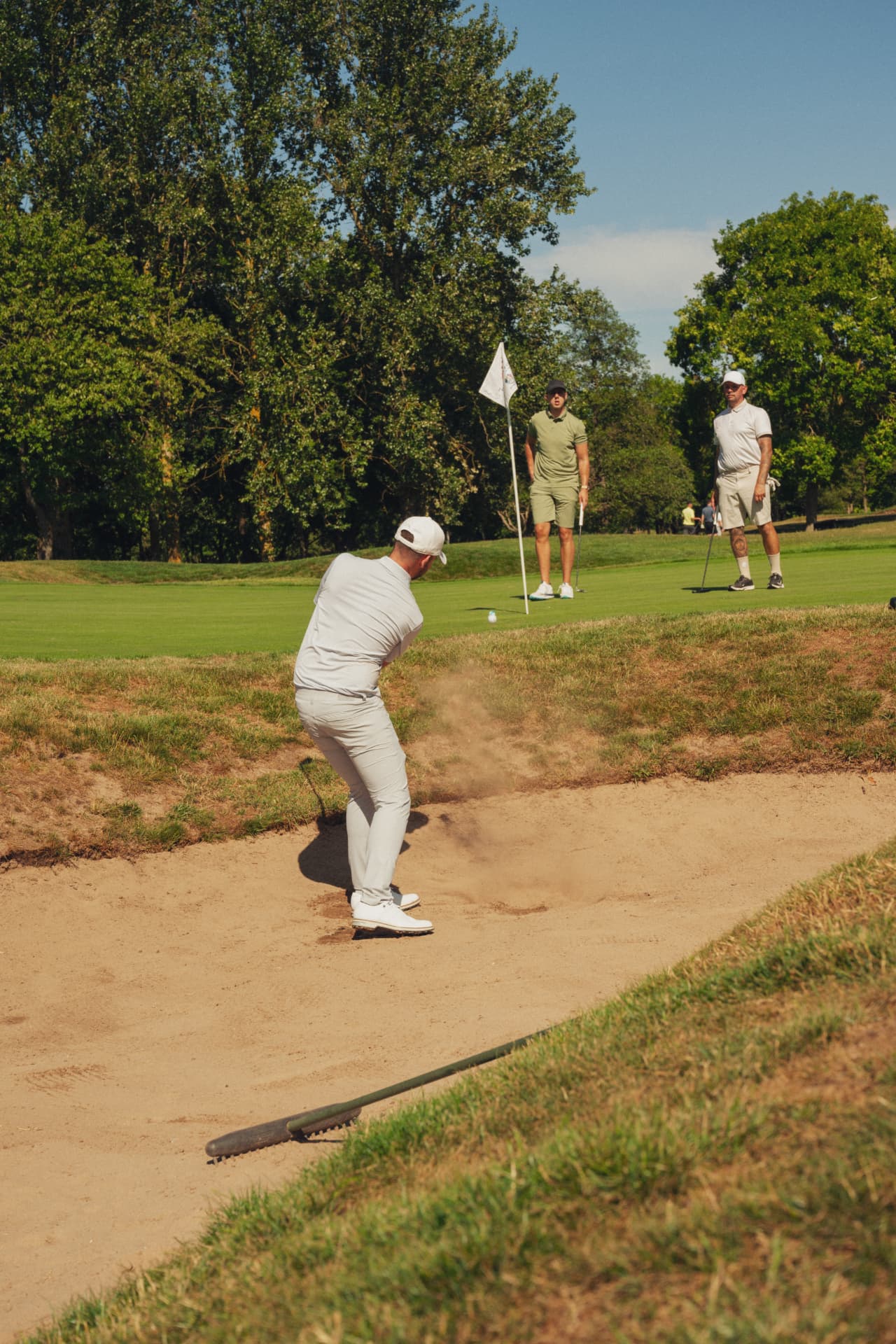 Member playing a bunker shot